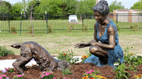 Woman with her dog at the Furever Friends pet memorial garden