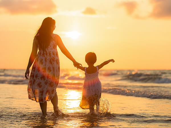 Family walking together at sunset